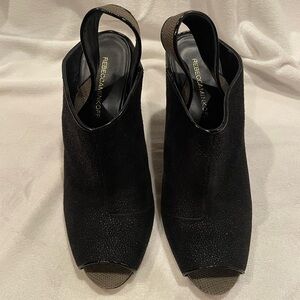 Rebecca Minkoff black heeled sling back wedges.